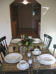 Dining room table complete with place settings
