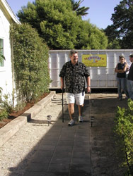 Homeowner returning through the newly landscaped yard